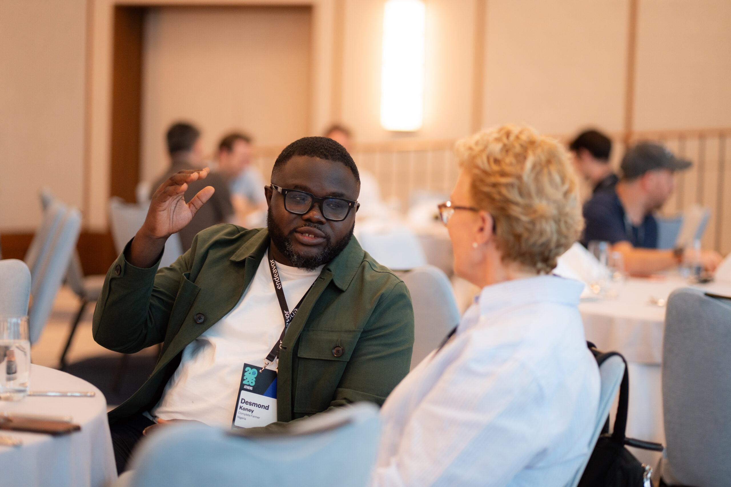 Desmond Koney in conversation with a panelist at the 108th International Selection Panel in Athens
