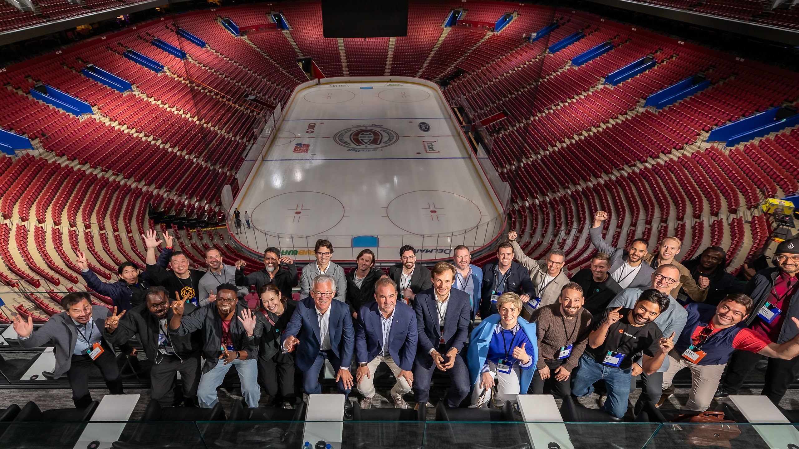 Group photo of participants at the International Selection Panel, overlooking the ice rink at Centre Bell in Montreal